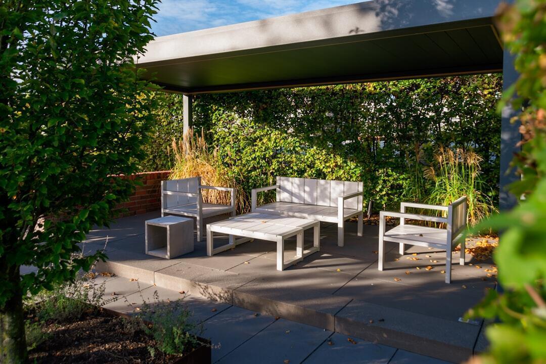 Elegant outdoor dining set arranged on a spacious backyard patio