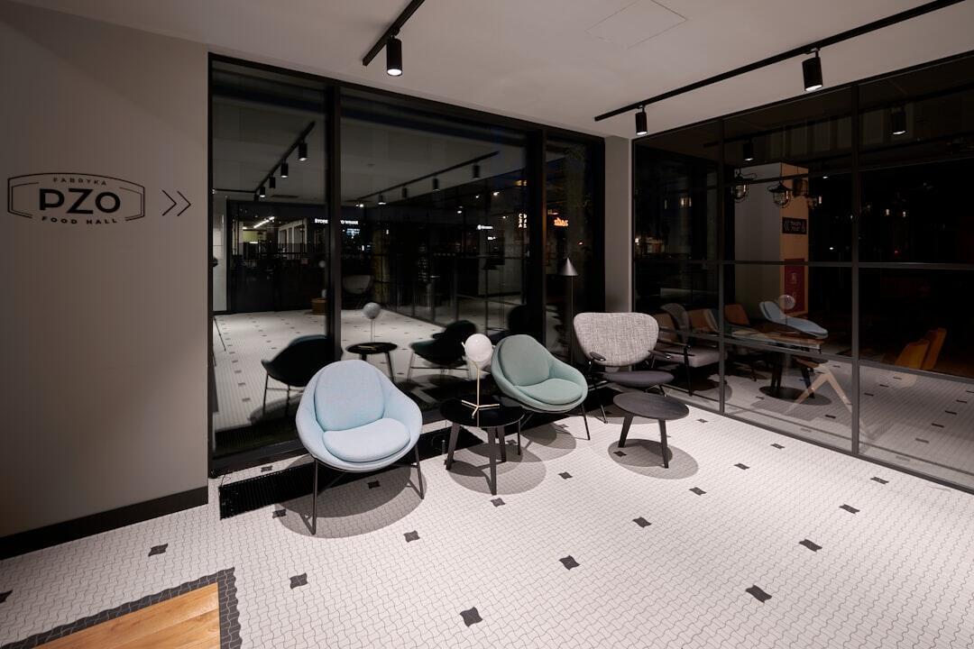 Interior of outdoor furniture showroom with various displays and seating arrangements