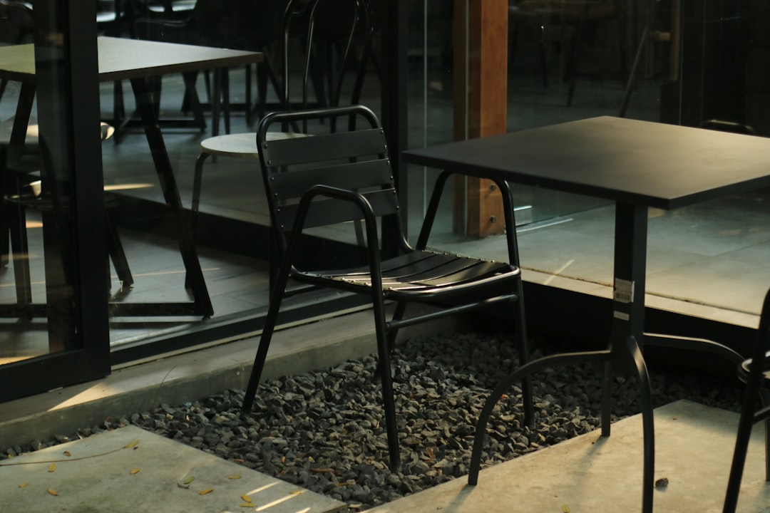 Beautiful teak dining set on sunny patio with natural wood grain visible